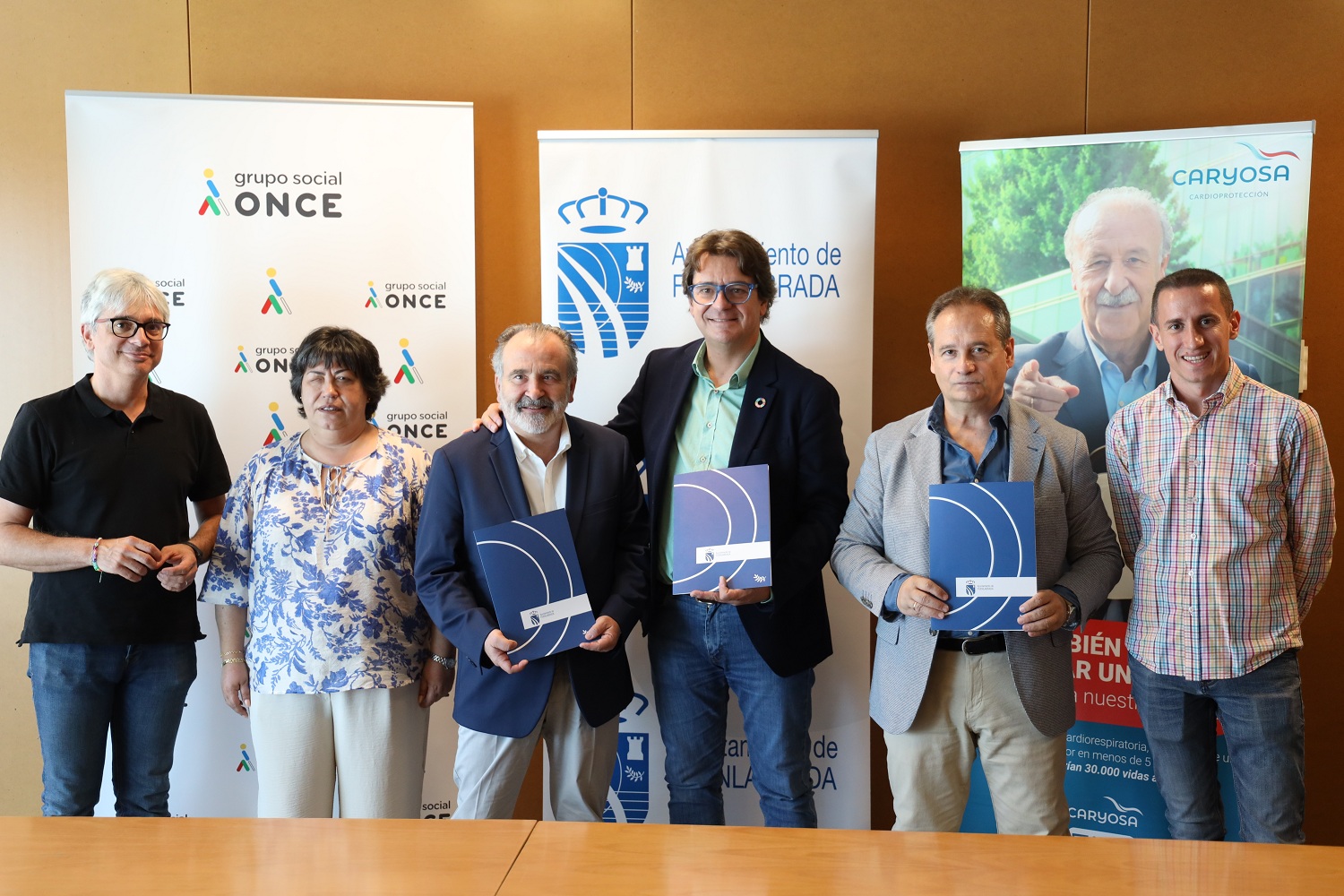 Firma del convenio con Once y Caryosa